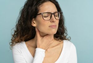 Sick Woman Having Sore Throat