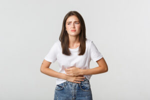 Bloated stomach and feeling sick and tired female